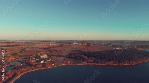 Aerial shot of beautiful riverside with a forest