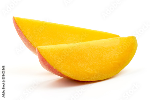 Juicy ripe Mango fruit slices, close-up, isolated on white background