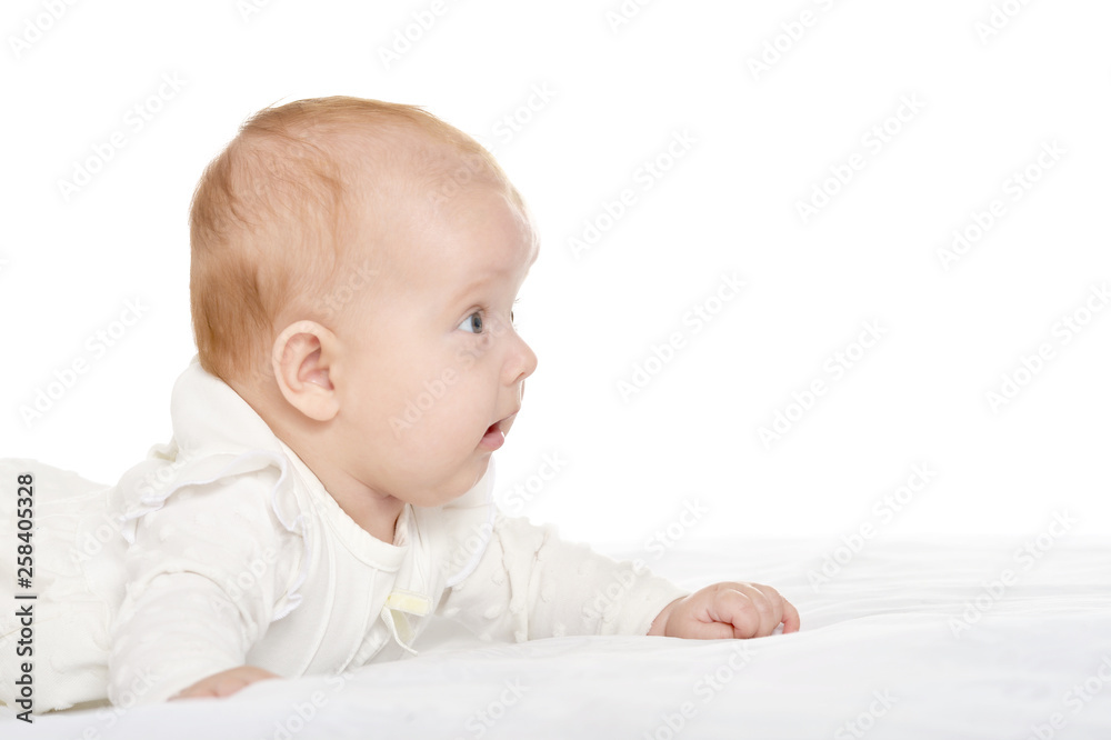 Portrait of adorable baby girl on blanket on a white background Portrait of adorable baby girl on blanket on a white background