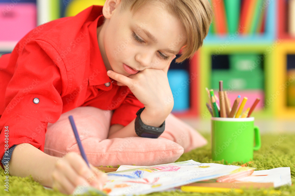 Portrait of cute little boy drawing with pencils Portrait of cute little boy drawing with pencils
