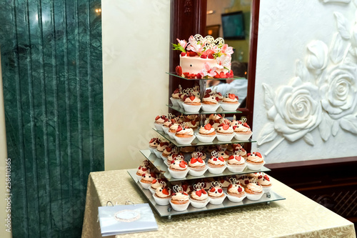 Candy Bar. Delicious sweet buffet with cupcakes. Sweet holiday buffet with cupcakes