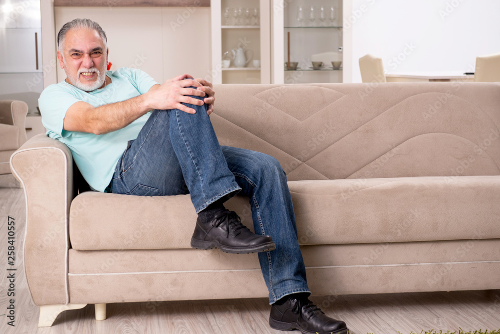 White bearded old man suffering at home White bearded old man suffering at home