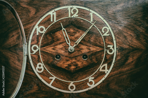 Dial of old wooden clock