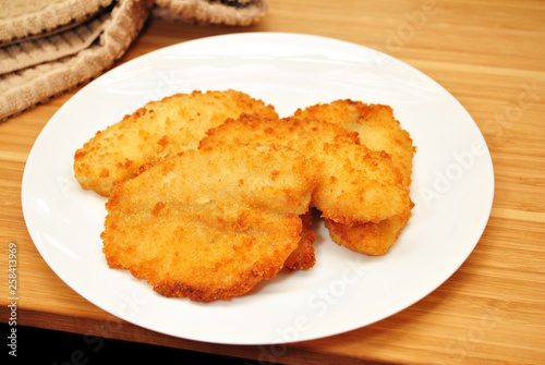 Fried Breaded White Fish on a White Plate