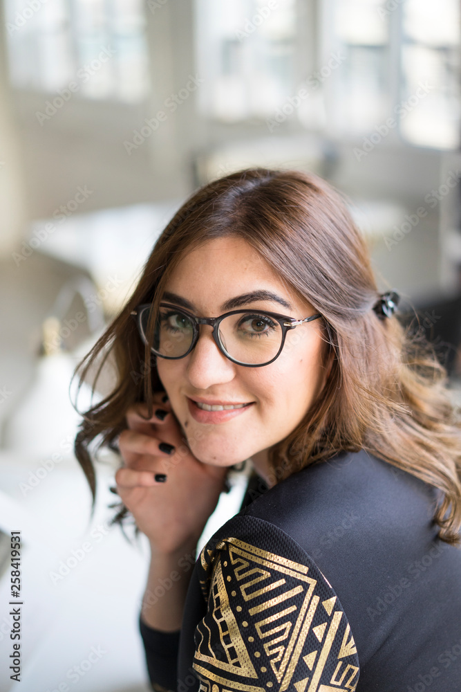 Portrait of smiling young designer in an atelier Portrait of smiling young designer in an atelier