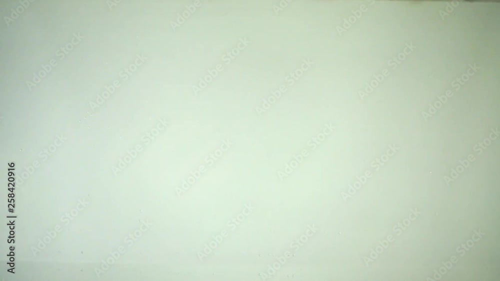 Cherry tomatoes in water. Slow motion.