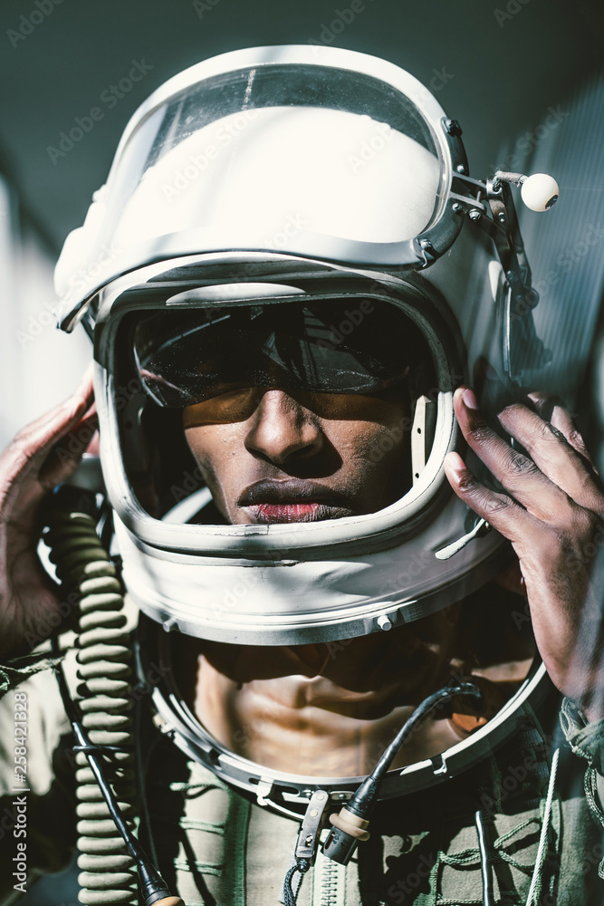 Portrait of serious astronaut in spacesuit Portrait of serious astronaut in spacesuit