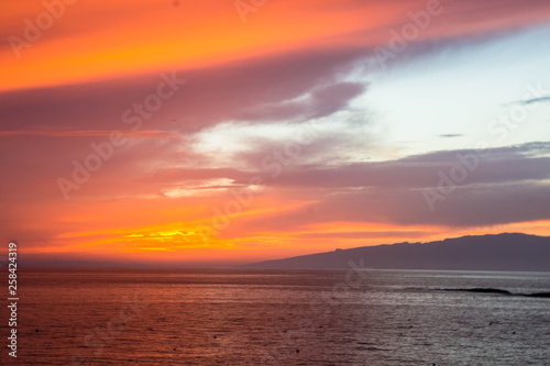 beautiful sunset over the Atlantic ocean at Costa Adaje, Tenerife Island, Spain © Tomtsya