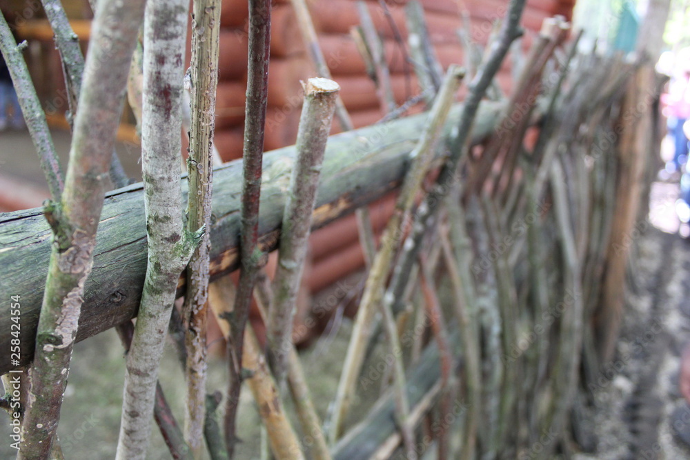 old wooden fence from branches old wooden fence from branches