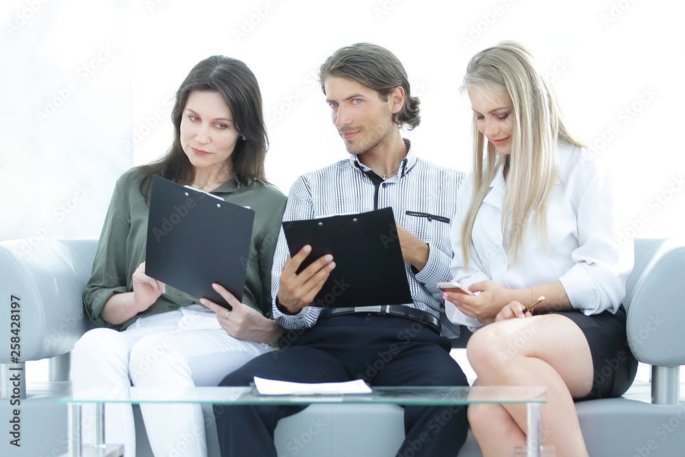 business team reading work documents.office life. closeup. business team reading work documents.office life. closeup.