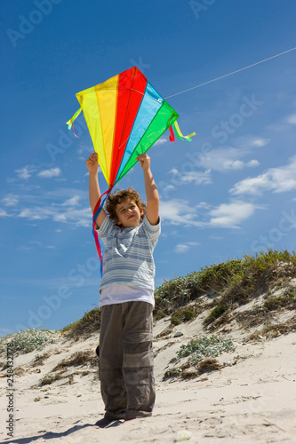 Young boy flying a kite 