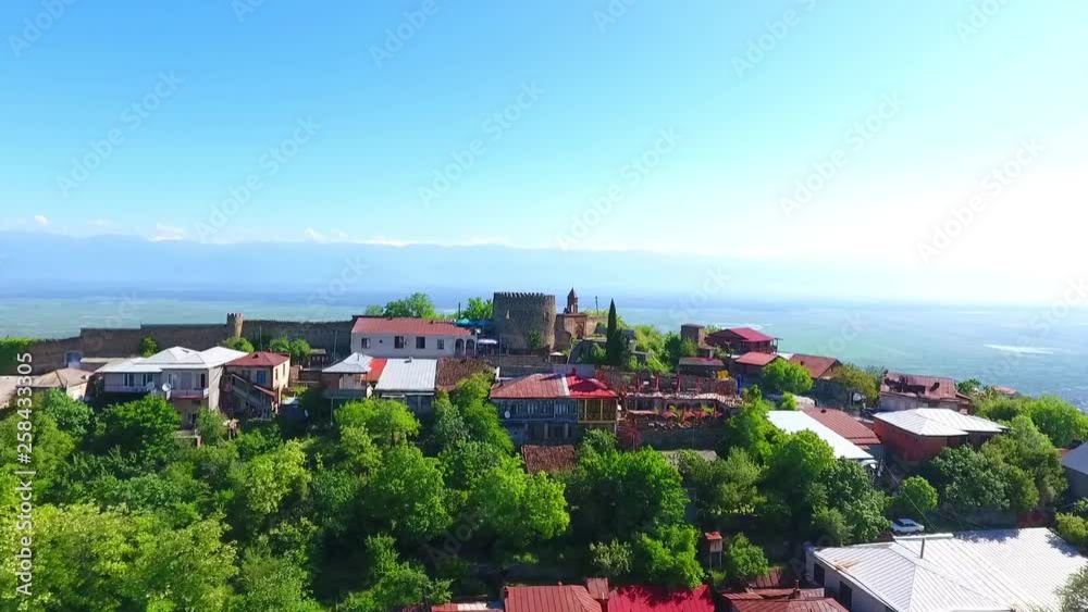 Aerial view to Sighnaghi city - georgian town Signagi in Georgia's easternmost region of Kakheti. Important center of Georgia's tourist industry. Alazani valley in Georgia Aerial view to Sighnaghi city - georgian town Signagi in Georgia's easternmost region of Kakheti. Important center of Georgia's tourist industry. Alazani valley in Georgia