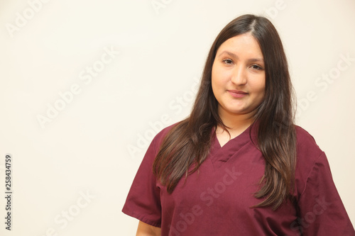 Female healthcare professional on white background with copy space.