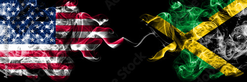 United States of America vs Jamaica, Jamaican smoky mystic flags placed side by side. Thick colored silky smoke flags of America and Jamaica, Jamaican