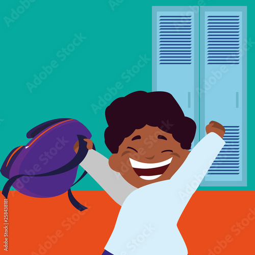 little black schoolboy with schoolbag in school corridor