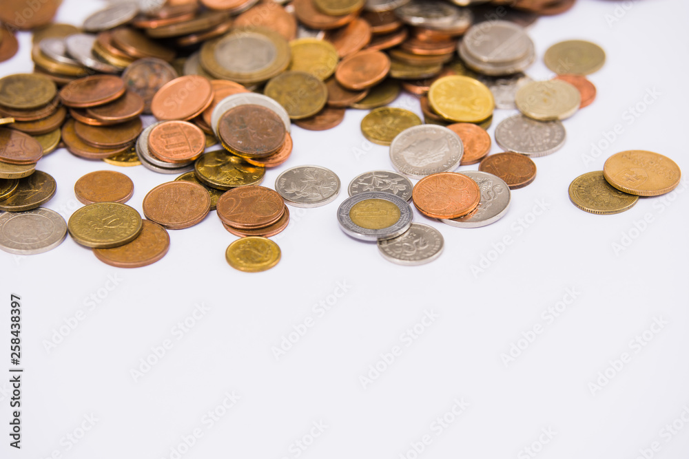 Heap of colorful coins on clear background Heap of colorful coins on clear background