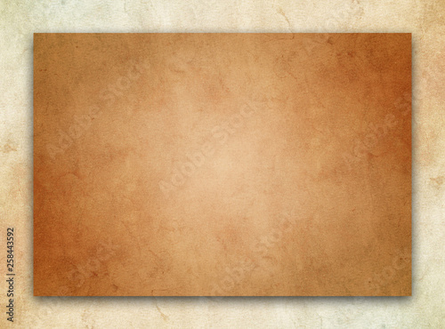Abstract design of dark, clean edged parchment texture over a tan stone border texture. 