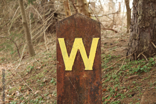 Rusted Letter W Signpost