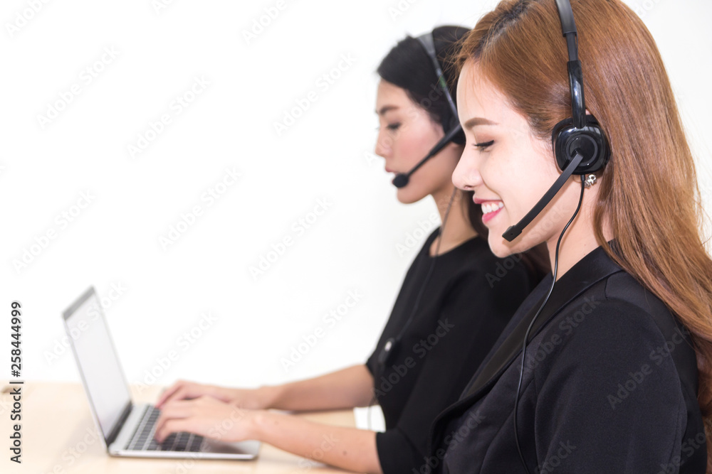 Beautiful businesswoman customer support services working with headset isolated on white background Beautiful businesswoman customer support services working with headset isolated on white background