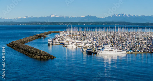 olympic mountains and boat marina in puget sound washington state photo