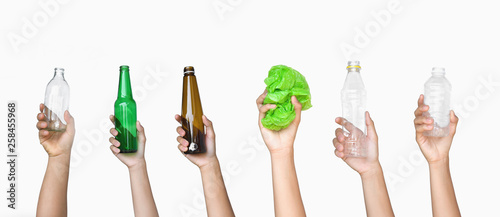 hand holding garbage of bottle glass and bottle plastic with plastic bag isolate on white background