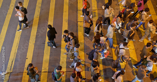 Photography Top view of people cross the road in Hong Kong at night