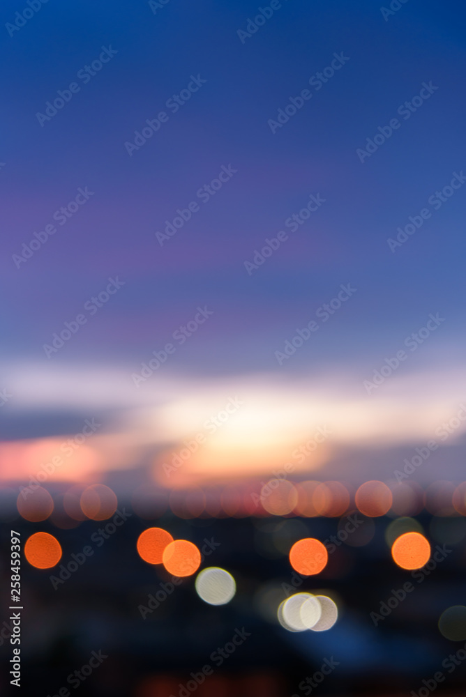 Defocused cityscape or city view with sweet pastel color sky and bokeh at sunset Defocused cityscape or city view with sweet pastel color sky and bokeh at sunset