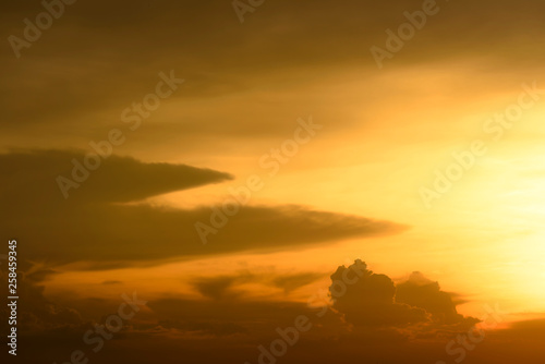 yellow and golden warm sunset with cloud