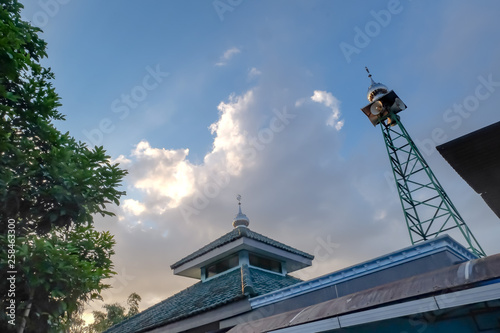rooftop view with loudspeaker tower on sunset time