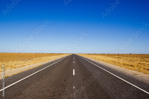 traight road in the dessert of Australia on the Flinders Hightway, Quennsland Australia