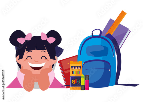 happy little schoolgirl with schoolbag and supplies