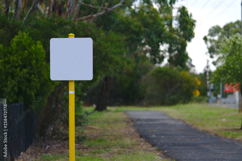 Blank signage on yellow pole