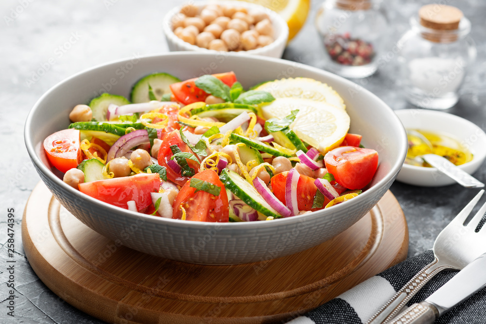 Salad of chickpeas, tomatoes, cucumbers and greens. Dietary food. Vegan salad.