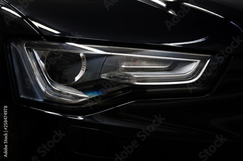 Car headlight. Exterior detail. © alexdemeshko