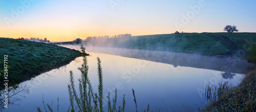 Foggy tranquil spring landscape with river © valeriy boyarskiy