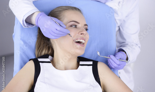 beautiful girl in the dental chair on the examination at the de