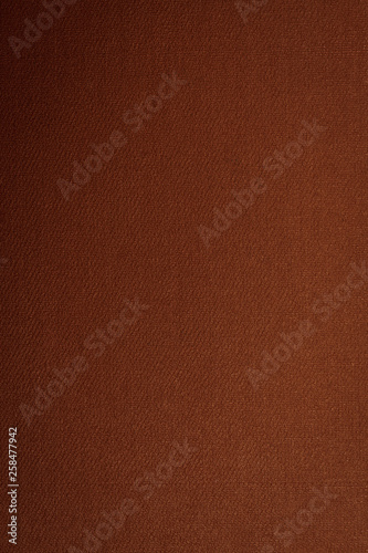 Brown-golden texture with gradient, background, abstraction. Space for text. Matte coating