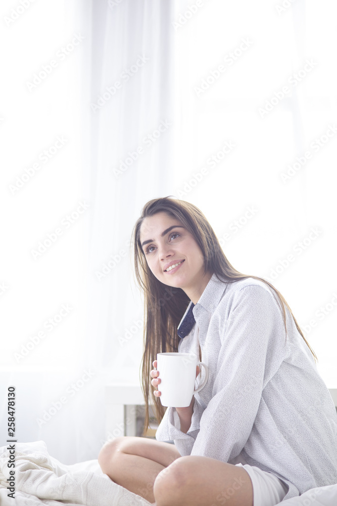 Young beautiful happy brunette woman in black silk dressing gow Young beautiful happy brunette woman in black silk dressing gow