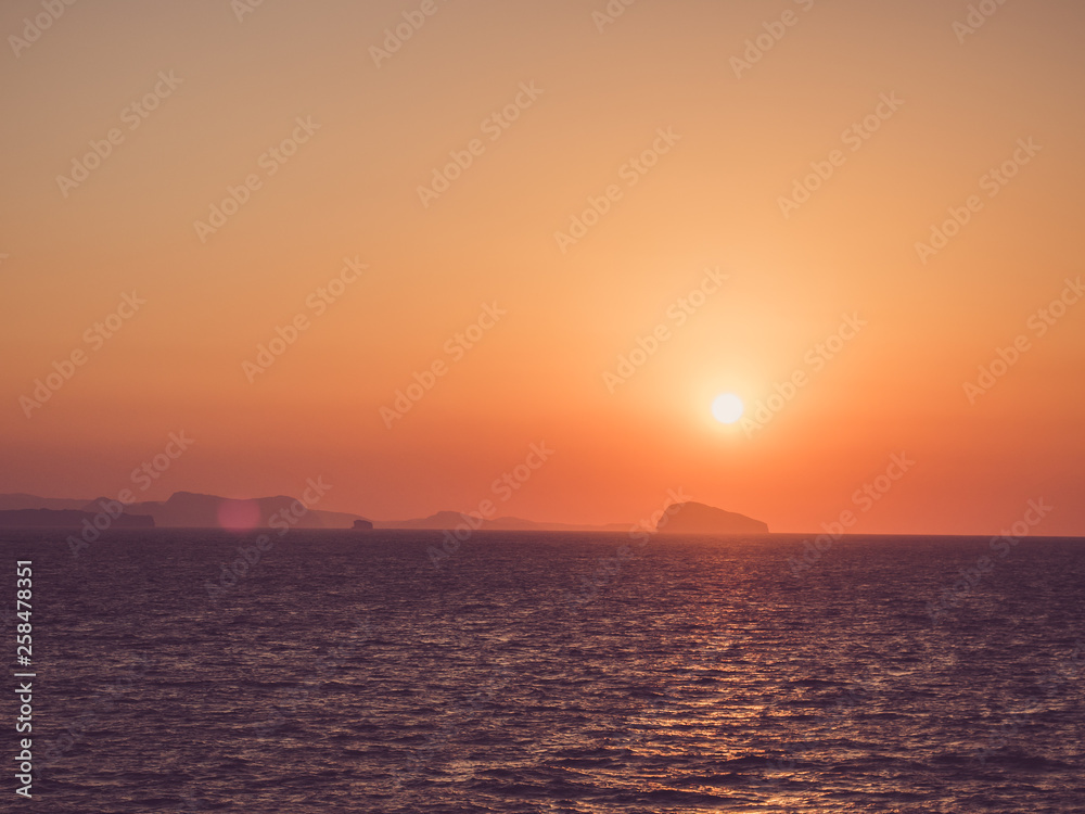 Beautiful sunset in the sea. View from a cruise liner. Concept of leisure and travel