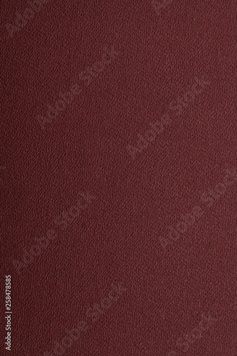 Maroon texture background, abstraction. Space for text. Matte coating