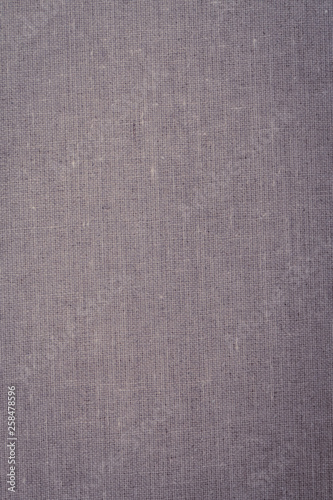 Gray-lilac fabric texture, background, abstraction. Space for text. Matte coating