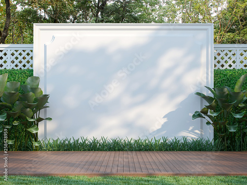 Empty white wall in the garden 3d render,  There is a wooden floor terrace,white wood lattice fence and nature background photo