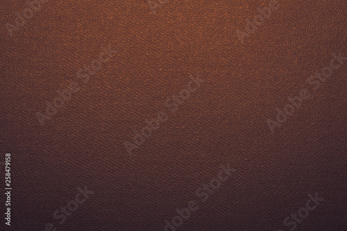Brown-golden texture with gradient, background, abstraction. Space for text. Matte coating