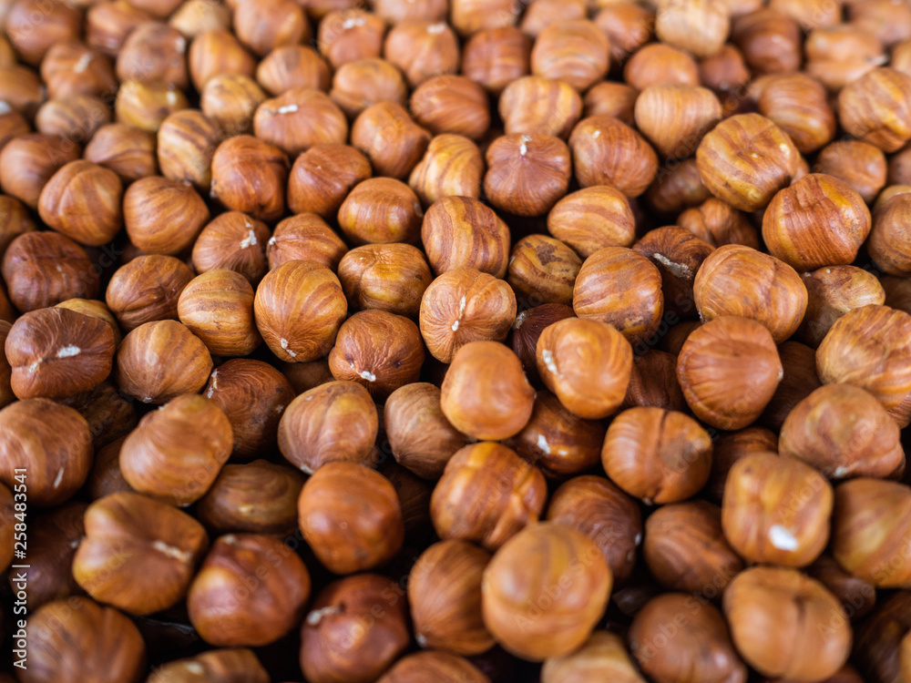 The peeled hazelnut. It is a lot of filbert on a counter of shop. Useful, nutritious product The peeled hazelnut. It is a lot of filbert on a counter of shop. Useful, nutritious product
