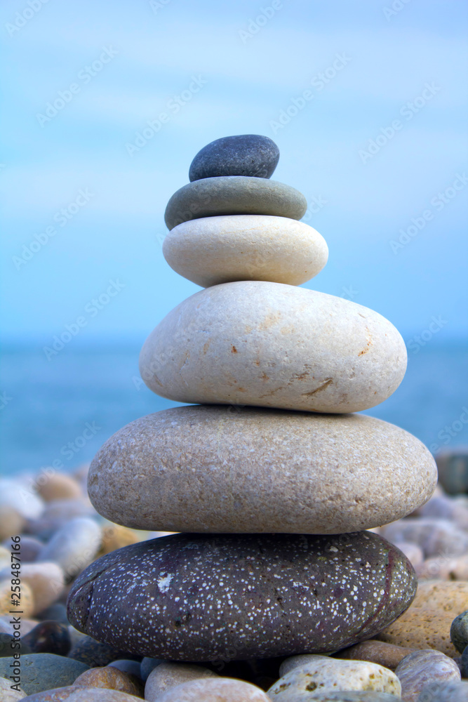 Pyramid of pebbles on the beach Pyramid of pebbles on the beach