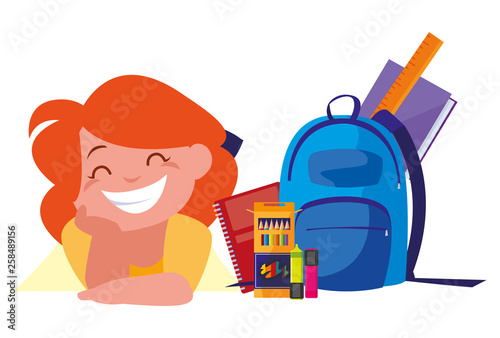 happy little schoolgirl with schoolbag and supplies