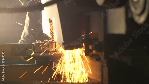 Many square and rectangular metallic billets lying on a flat machine tool
