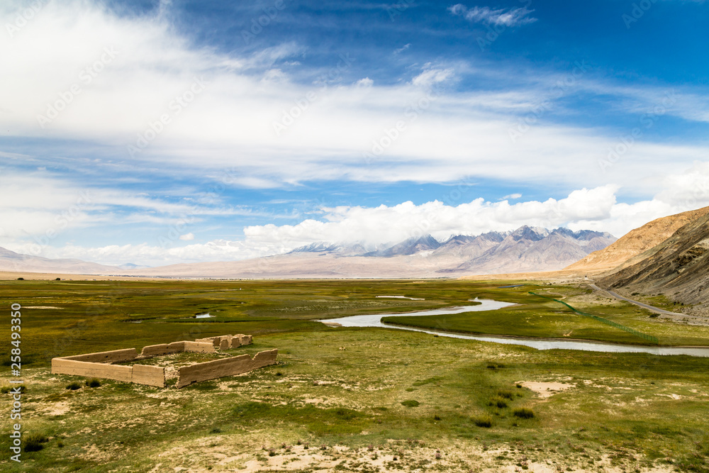 Tagharma viewing deck panorama on Pamir Plateau, at the feet of Muztagh Ata, China. This wetland is a bird paradise along the famous Karakorum highway, which has some of the best views of China