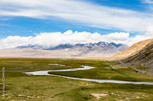 Tagharma viewing deck panorama on Pamir Plateau, at the feet of Muztagh Ata, China. This wetland is a bird paradise along the famous Karakorum highway, which has some of the best views of China photo