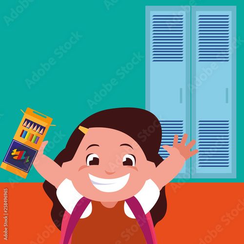 little schoolgirl with schoolbag in school corridor